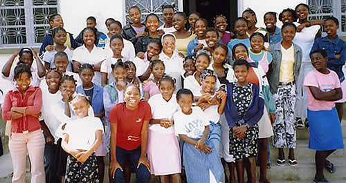 Children standing in front orphanage